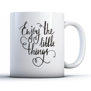 White mug with printed text "Enjoy the little things"